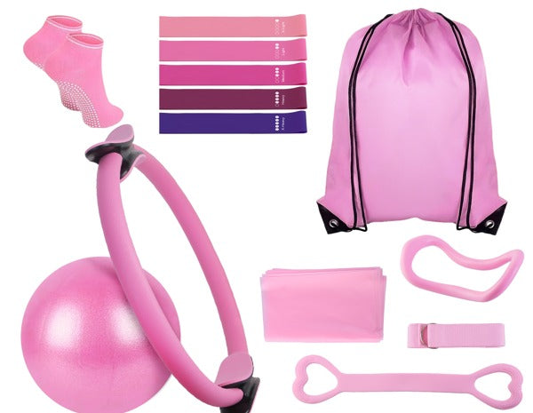 Everything in the Gaudeia Flow Set laid out: the Pilates ring, the soft ball, the small stretch loop, five graded resistance bands, the long flat band, the adjustable strap, the grip socks and the carry bag.